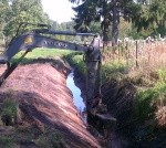 Tīra un sakārto grāvjus un caurtekas Zaļās birzs mikrorajonā