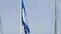Jahtu ostā pacelts Zilais karogs